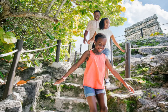 Lifestyle scene of a family exploring a natural path, emphasizing adventure and destination experience.